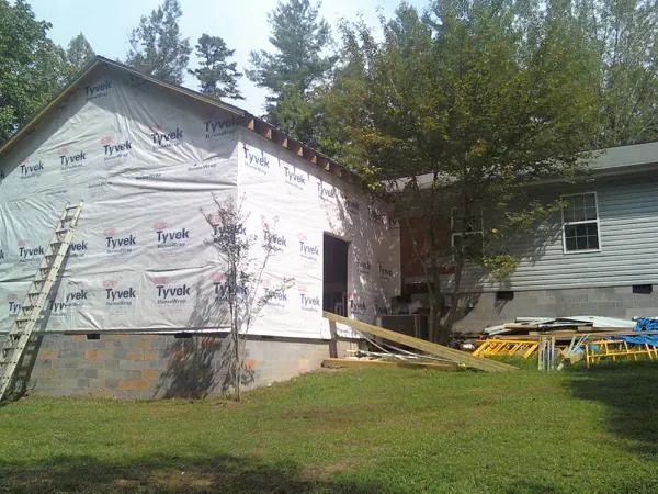 Tyvek wrapped gable on a new room addition beside an existing home in Arcadia